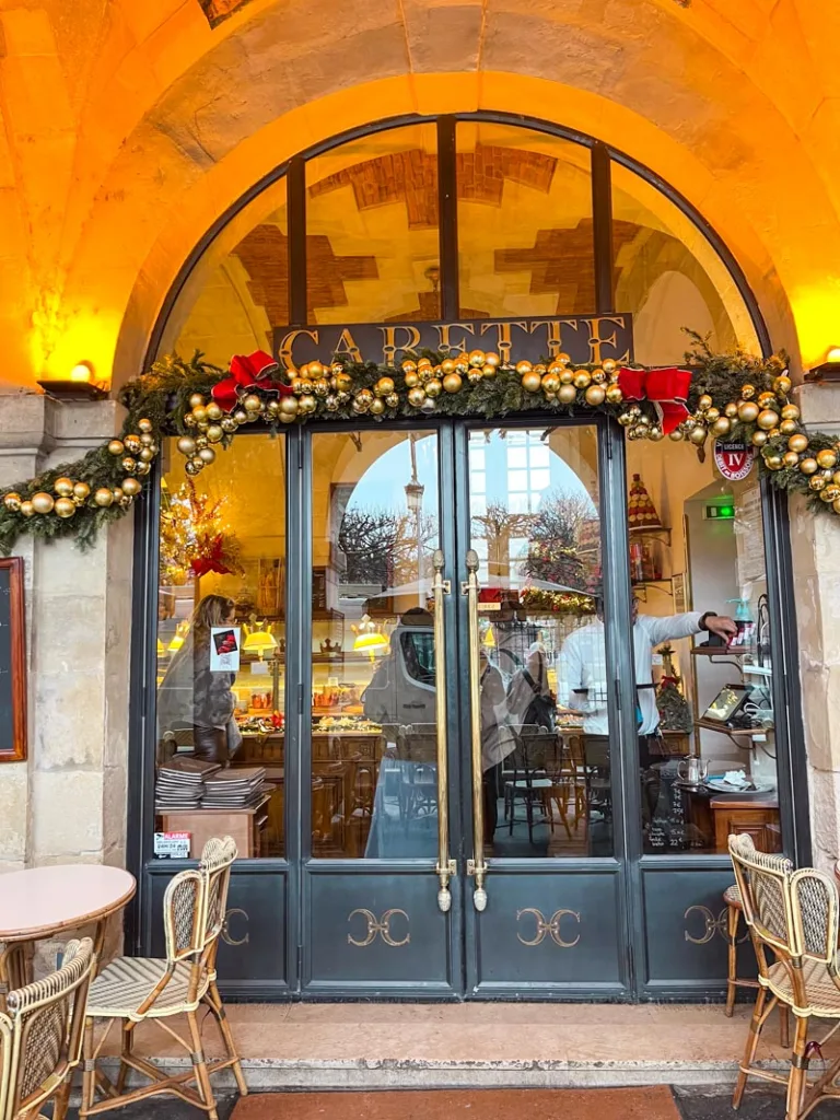 Vintage facade of Carette in Place des Vosges in Le Marais