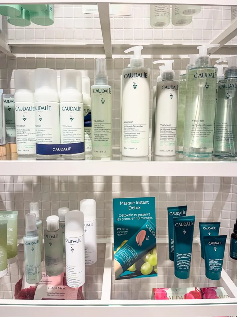 shelves with skincare items at the caudalie shop in le marais, paris