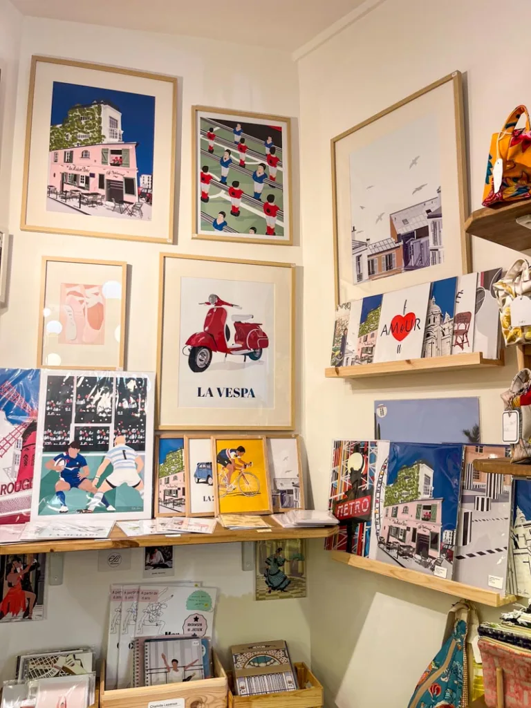 shelves with paris-themed prints at le fabrique 18 in montmartre