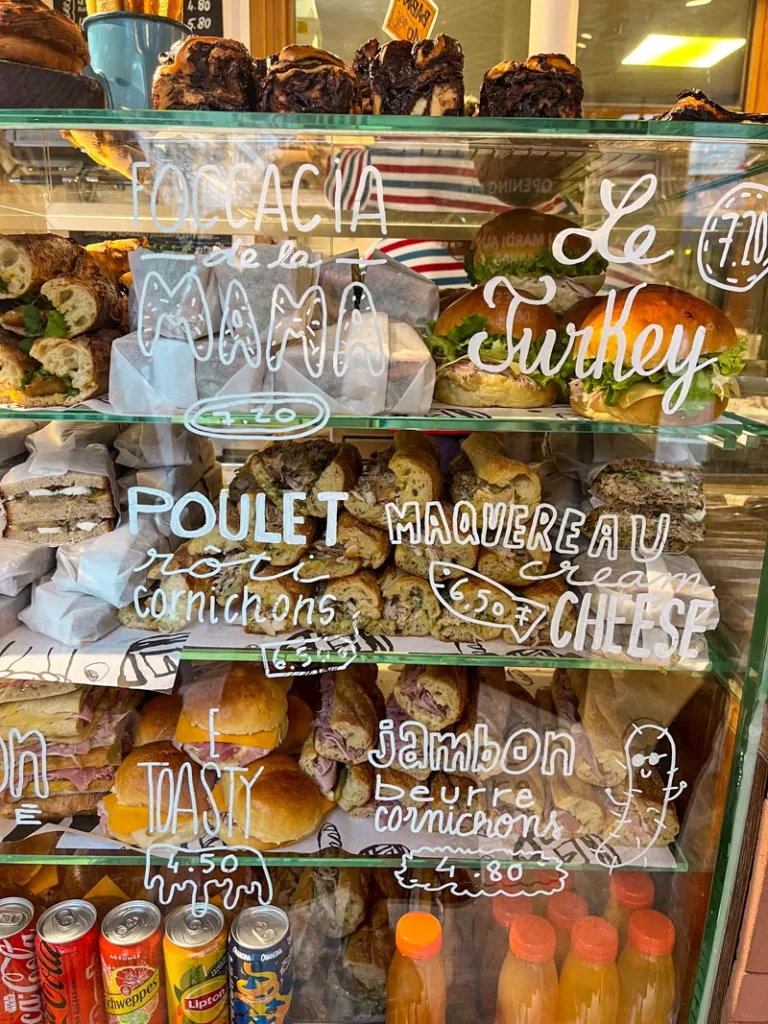 sandwiches on display at mamiche bakery in paris
