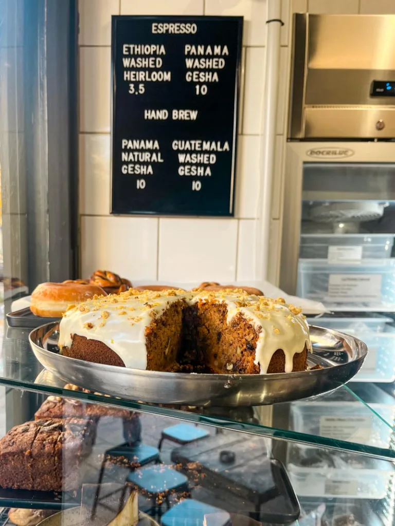 carrot cake on display at motors coffee in paris