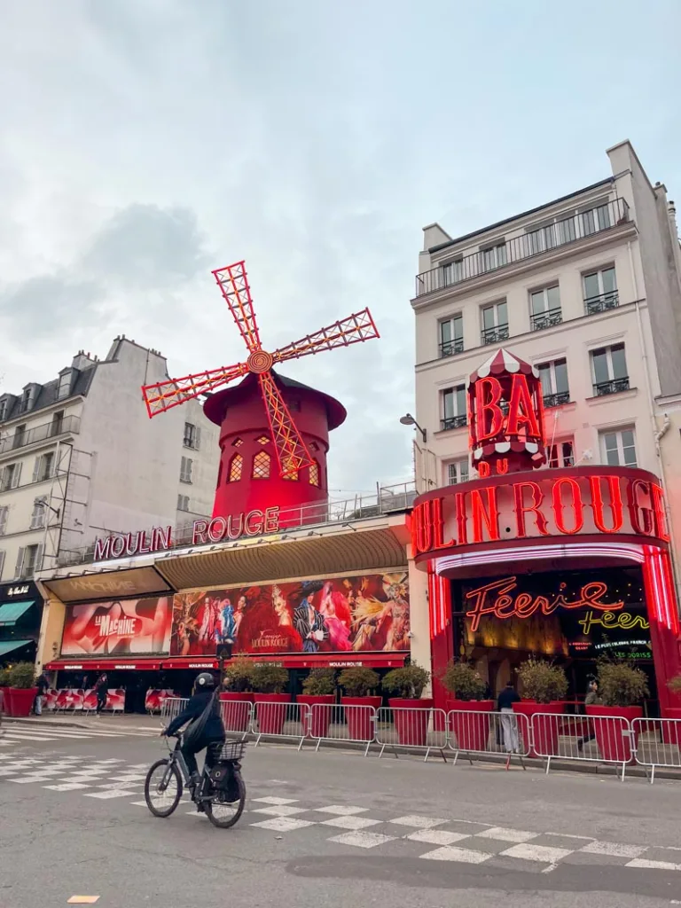 the iconic facade of the moulin rouge with its windmill
