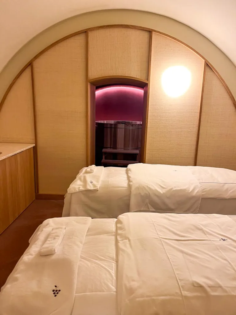 two spa beds inside a cream colored room at caudalie spa in paris