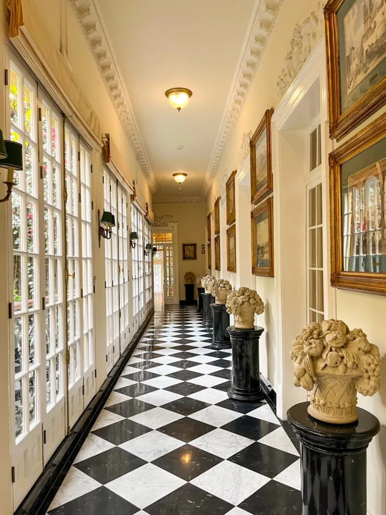 black and white checkered floor inside casa guillermo de tovar, a free museum in la roma in mexico city