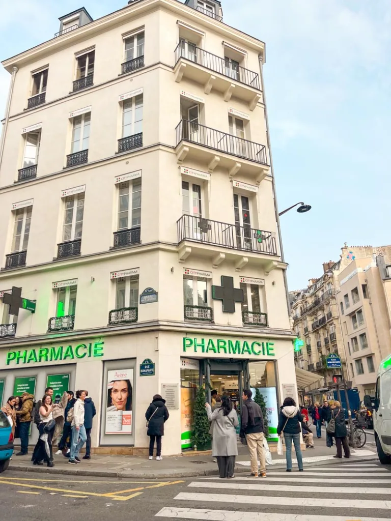 facade of the three-story tall citypharma shop in saint germain des pres, paris