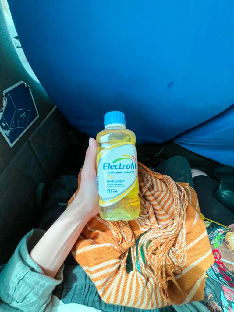 hand holding electrolit, a Mexican hydrating drink