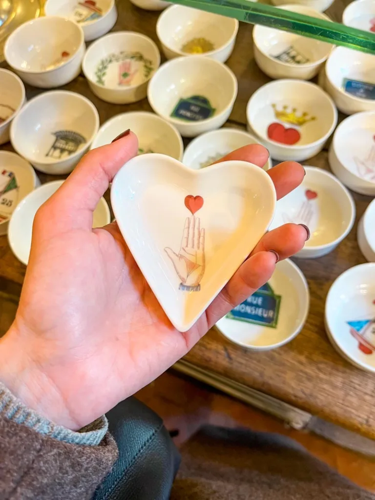 hand holding a heart-shaped ceramic bowl from main montagut in paris