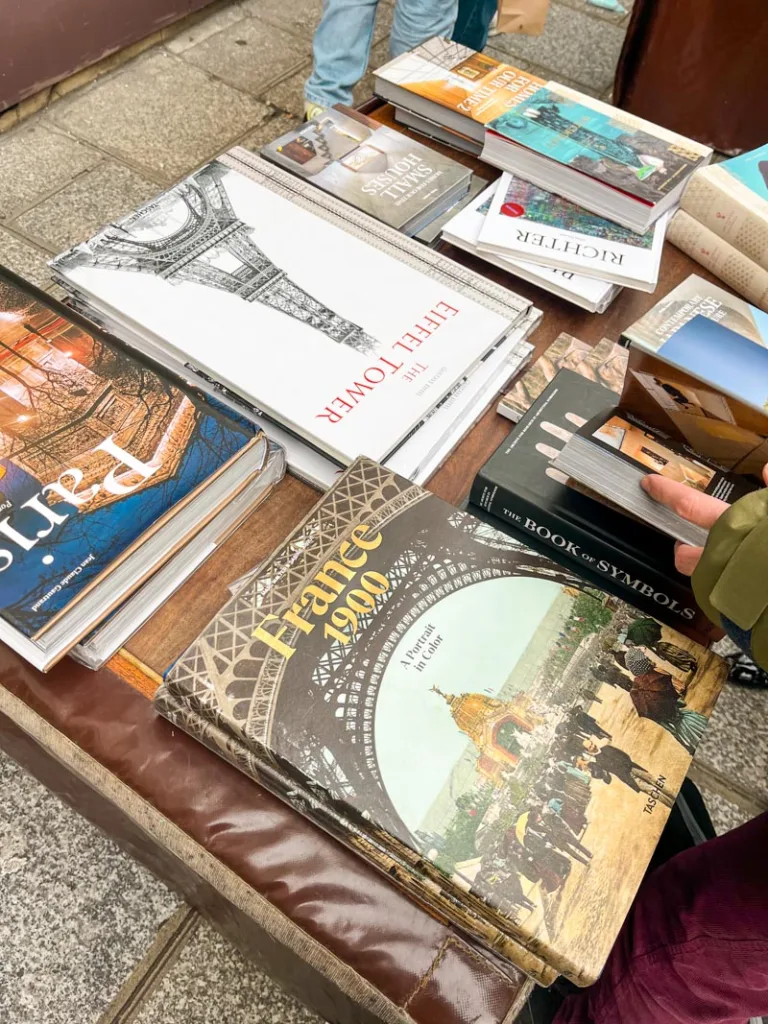 paris coffee table books on display on a table outside of taschen shop in paris