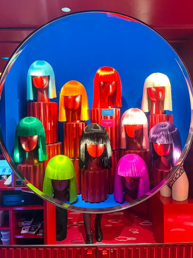 iconic colorful wig display at the crazy horse cabaret in paris