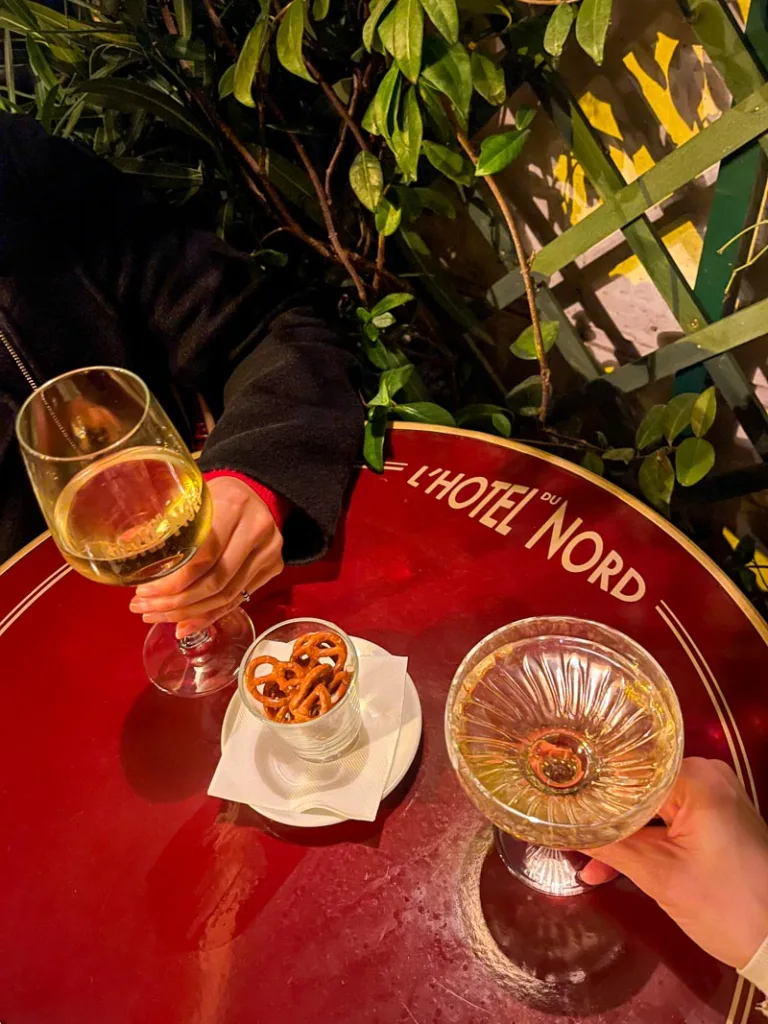 two glasses of champagne on a table at hotel du nord in paris