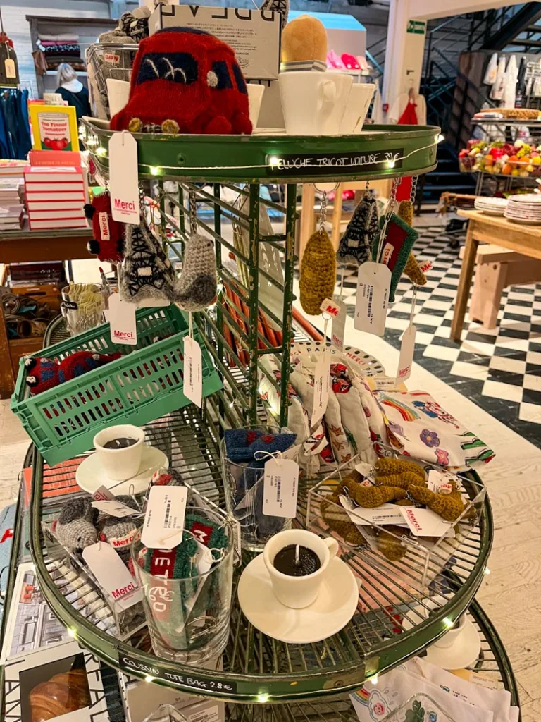 varied type of french-themed souvenirs at merci paris, from crochet tiny croissants, baguettes and metro signs