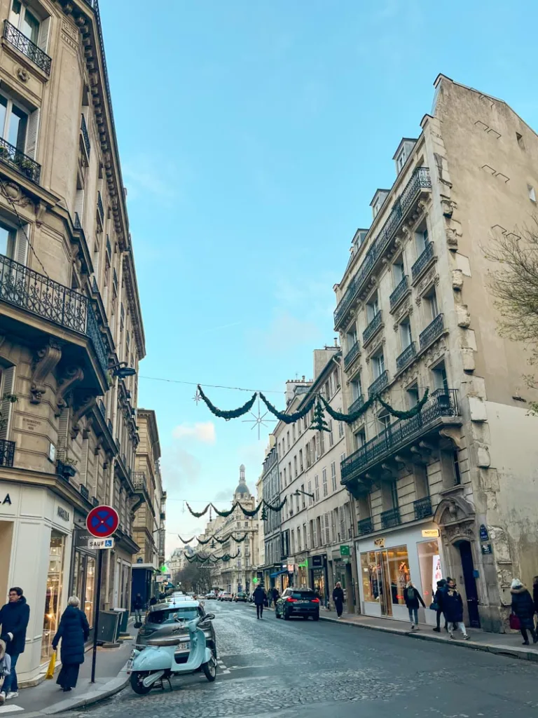 view of a calm shopping street in the passy neighborhood in paris