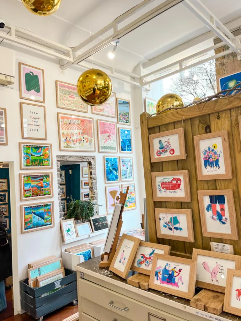 walls covered in colorful art works at slow galerie in paris
