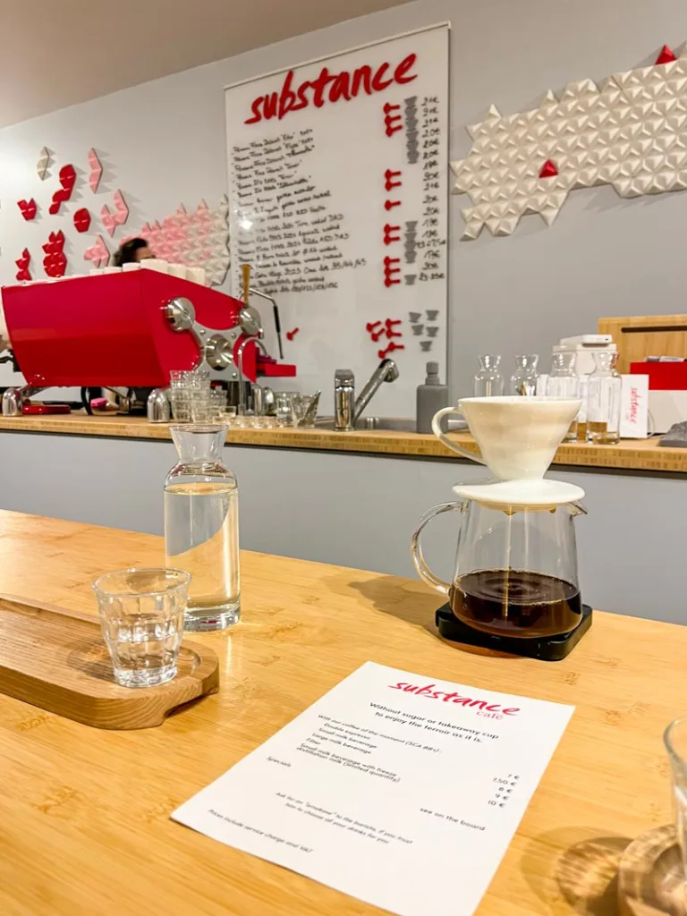 filter coffee being prepared on the wooden bar at substance cafe in paris