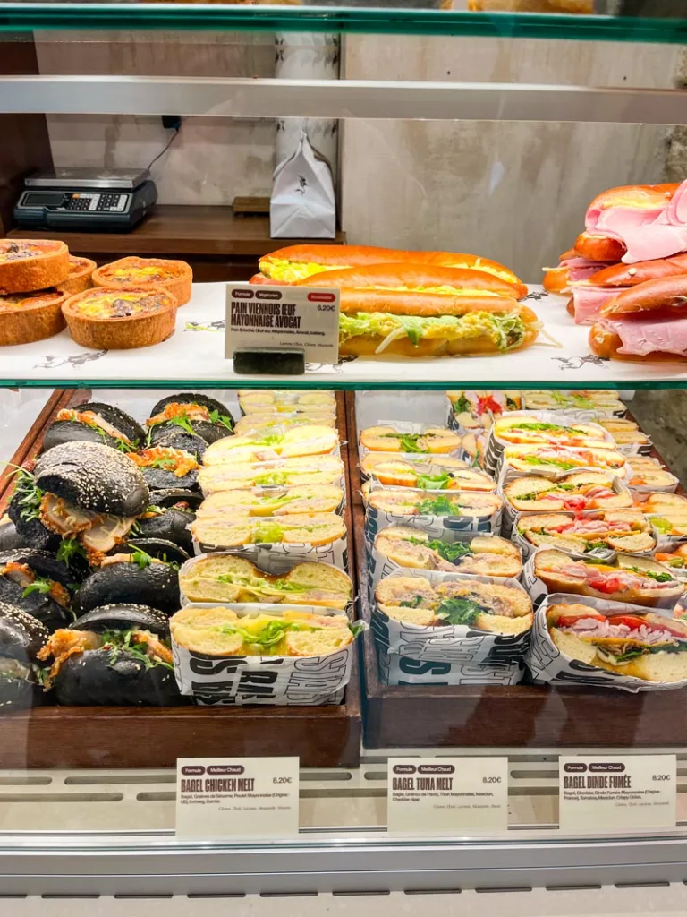 bagels and sandwiches on display at french bastards bakery in paris