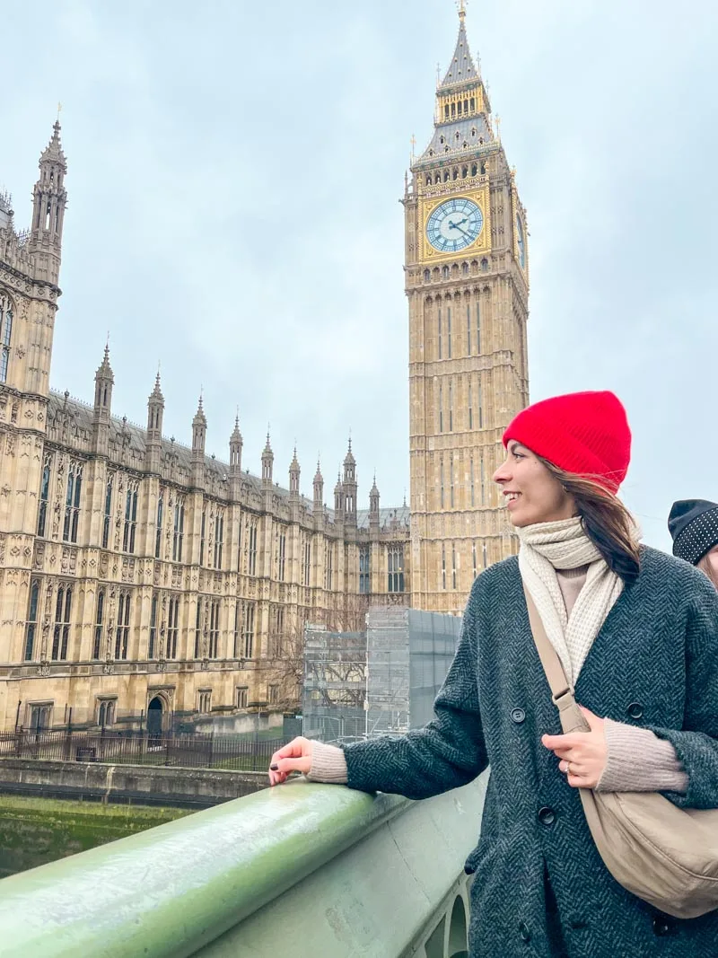 woman starting at the distance in front of big ben in london