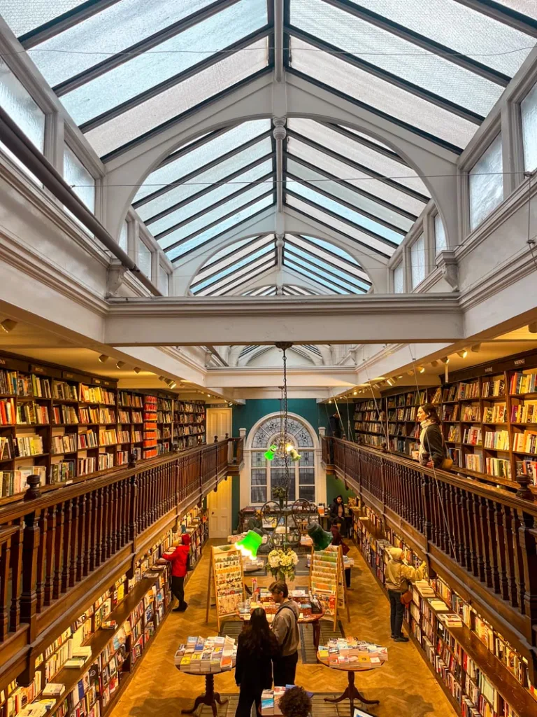 glass ceilings and dark bookshelves at daunt books in marylebone london