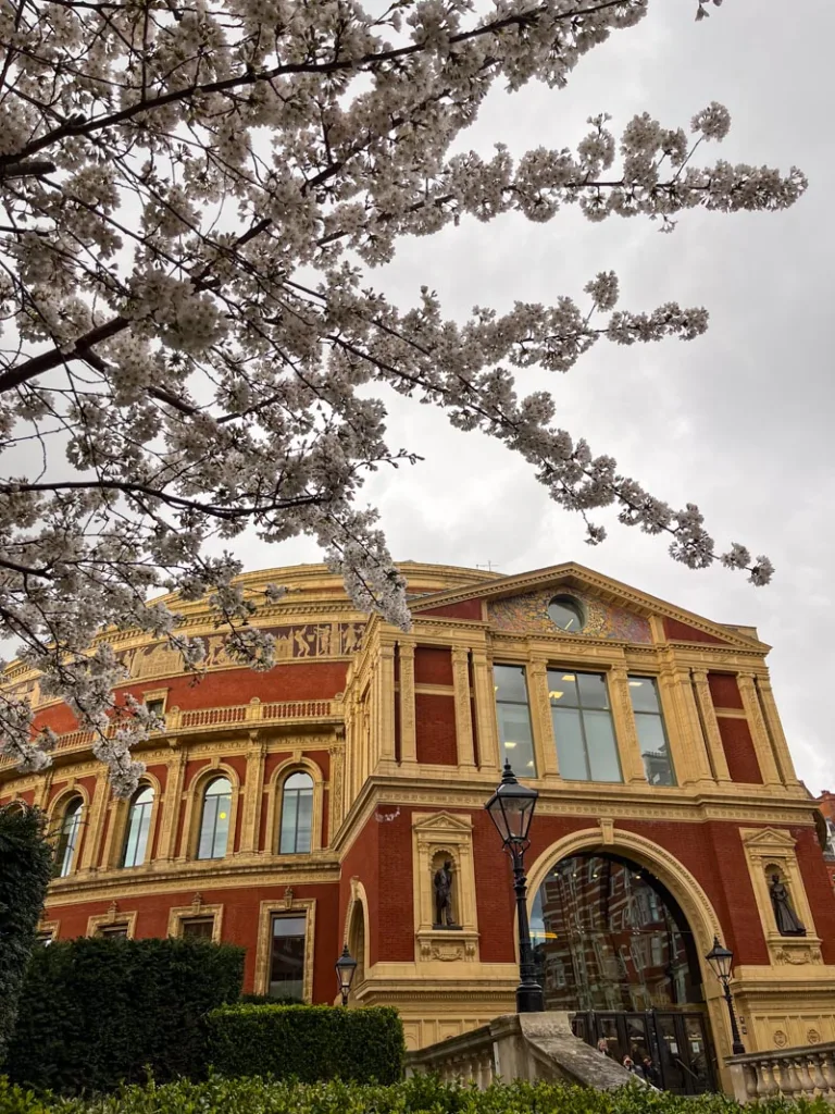 the orange-brick buildling of the royal albert hall in london