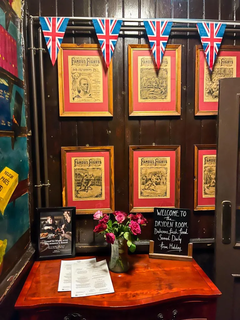dark wood walls and union jack flags decorating the lamb and flag pub in london