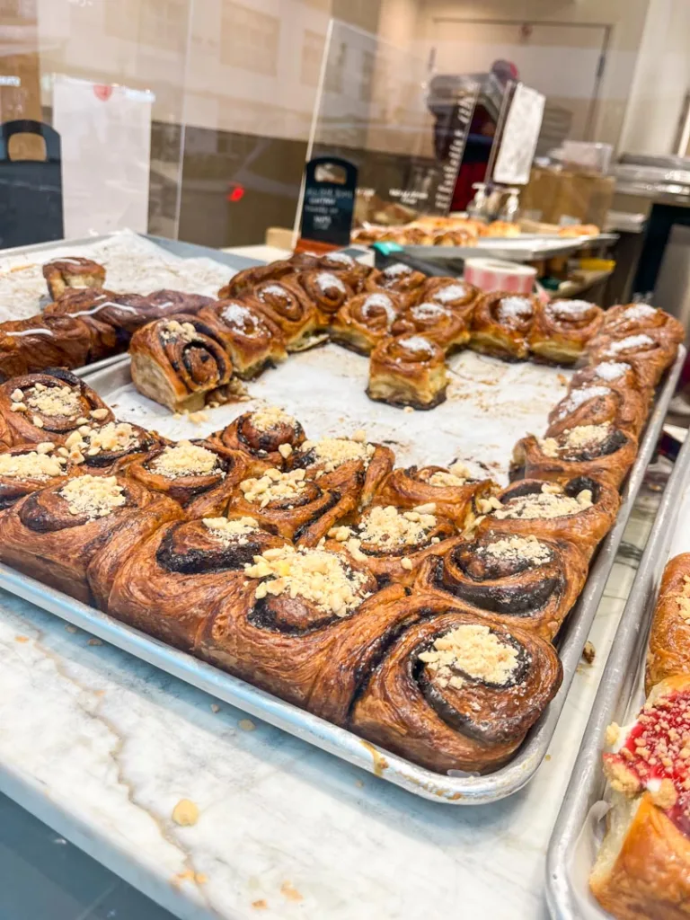 big cinnamon buns on a window display at a buns from home location in london