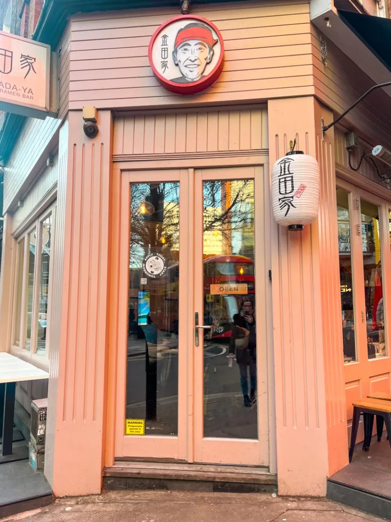 light pink facade of a kanada-ya ramen location in london