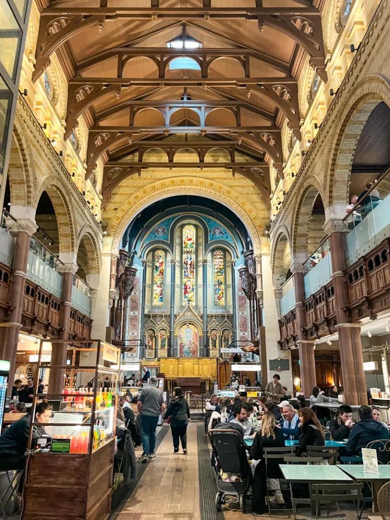 food court tables set up inside an old church at mercato mayfair in london