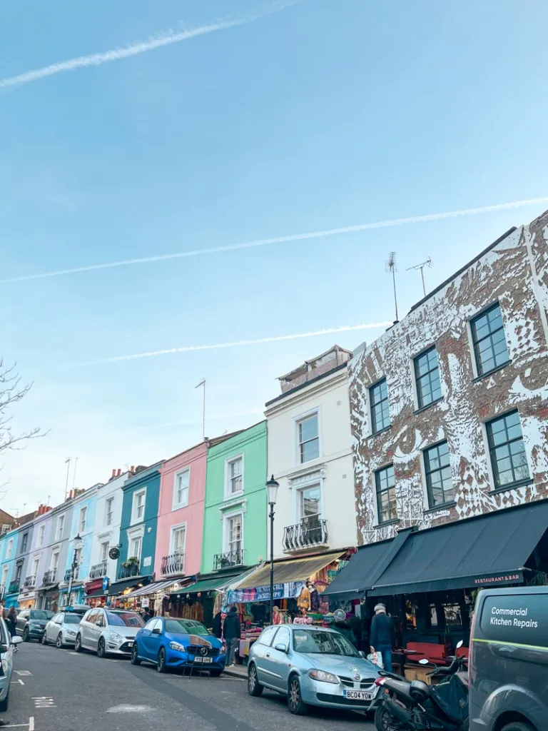 colorful houses and stalls along the portobello road market in notting hill, london