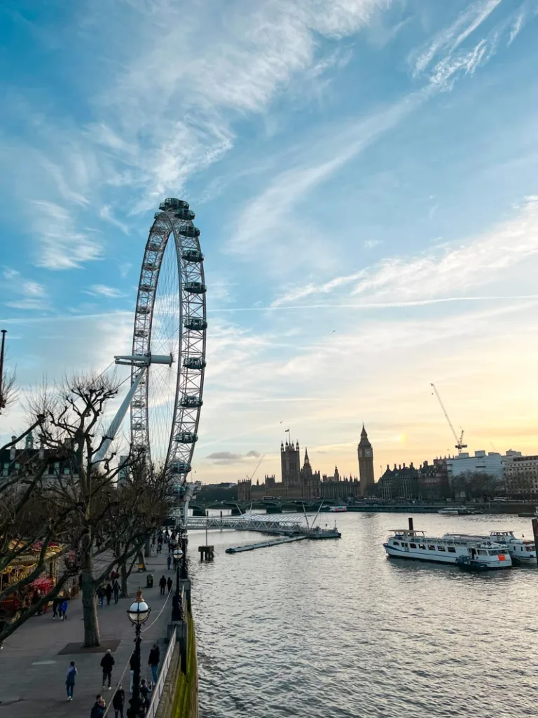 london skyline from london bridge with the london eye, big ben and wesminster abbey in the distance