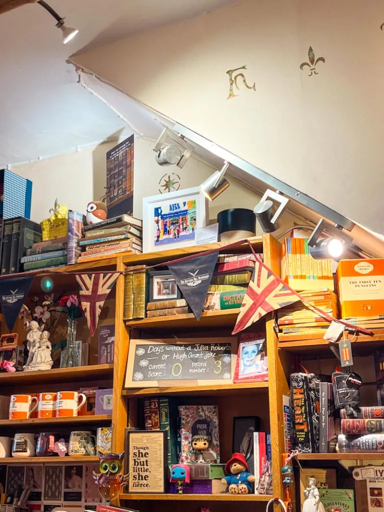 bookshelves packed with books and trinkets at the notting hill bookshop in london